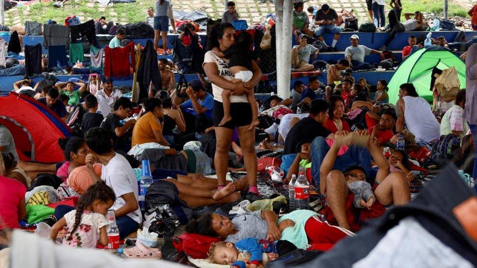 Migrants traveling in a caravan rest before continuing their journey through Mexico in an attempt to reach the U.S border, in Huixtla, Mexico, November 1, 2023