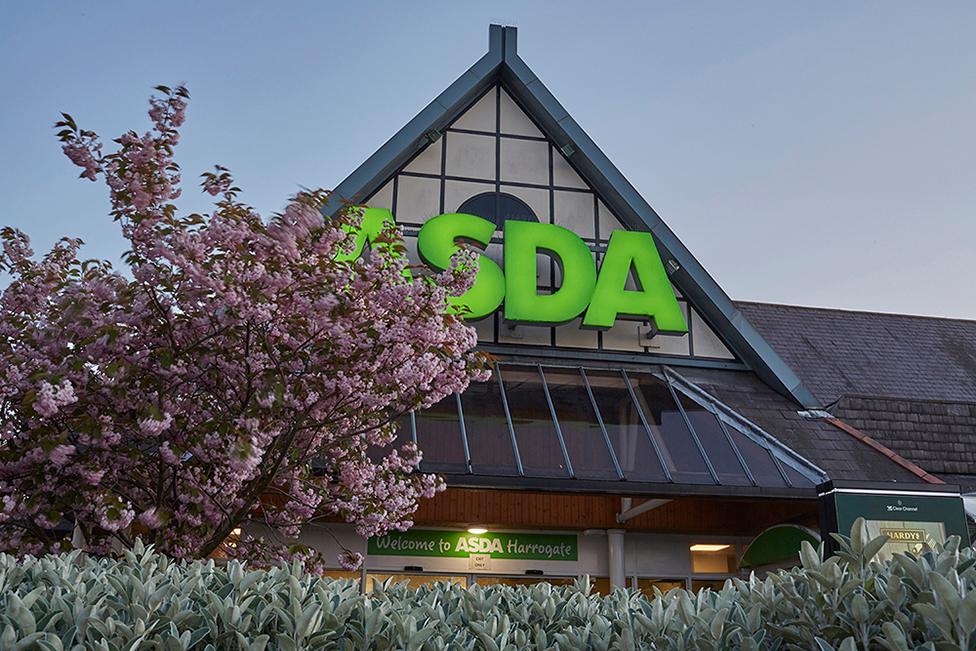 A view of an Asda sign and a blossom tree