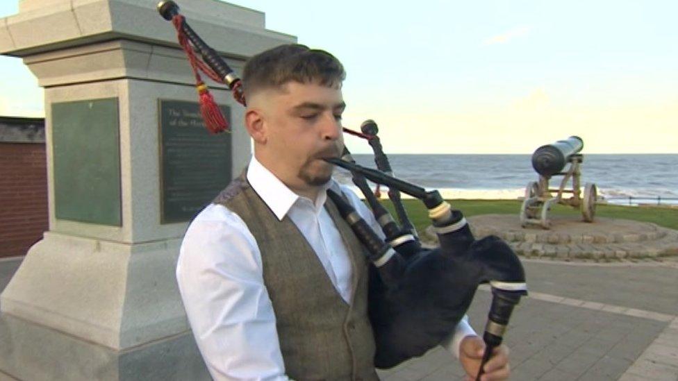 Chris Pearson playing the bagpipes in Hartlepool