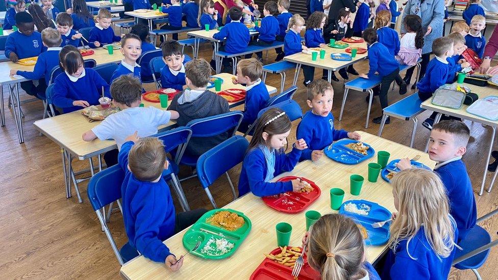 Windwhistle Primary School pupils eating a meal