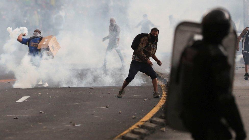 Protesters attend a demonstration against the ending of fuel subsidies in Ecuador