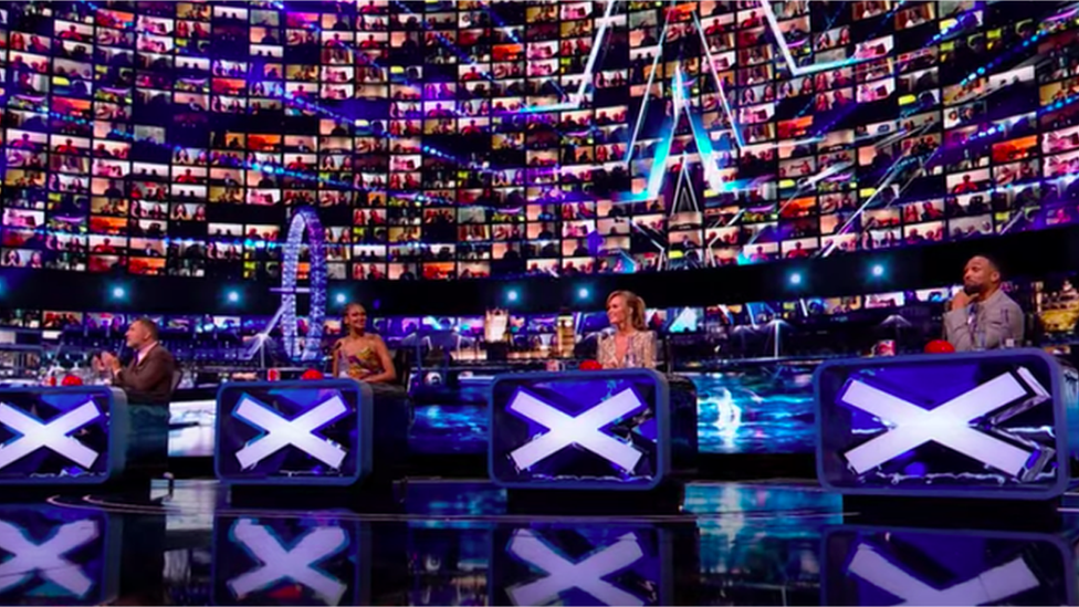 judges with a virtual wall of audience members