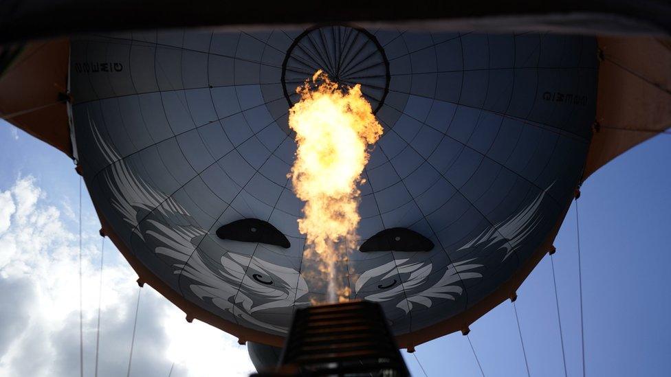 Hot air being poured into the hot balloon