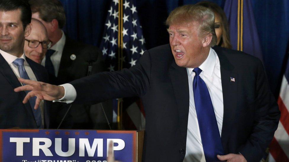 Republican U.S. presidential candidate Donald Trump reacts at his 2016 New Hampshire presidential primary night rally in Manchester, New Hampshire February 9, 2016