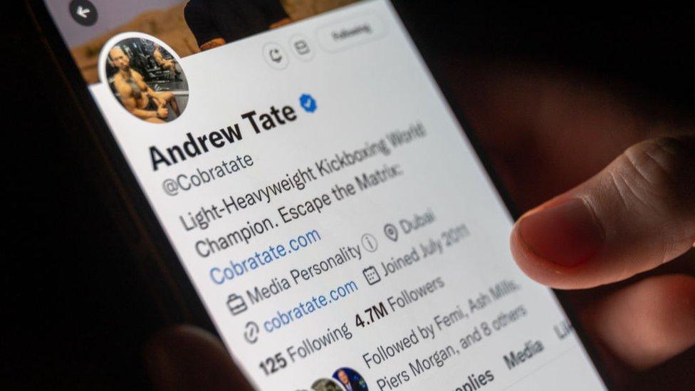 Andrew Tate's Twitter profile open on a mobile phone screen