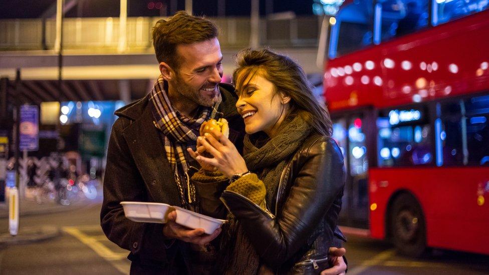 Couple eating takeaway