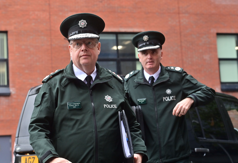 Deputy Chief Constable Mark Hamilton stands behind former-Chief Constable Simon Byrne