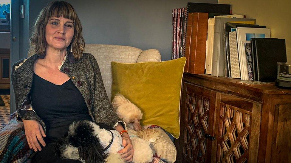 Abigail Wooding in lounge with her dog