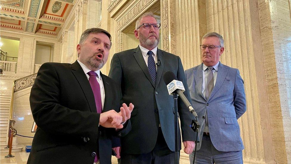 Robin Swann, Doug Beattie and Mike Nesbitt in the Stormont Great Hall