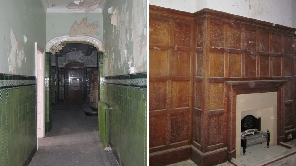 A hallway covered with peeling paint and a room with wooden panels and a fireplace