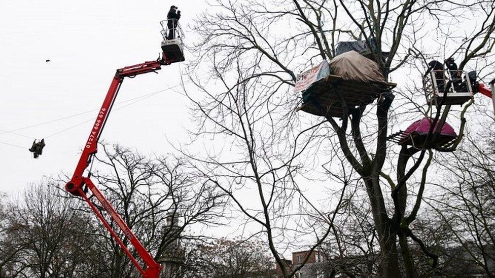 Enforcement officers using aerial platforms to try and coax HS2 protesters down from trees