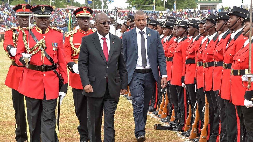 President John Magufuli reviews an honour guard of troops as he attends a ceremony marking the Tanzania's 56th independence anniversary in Dodoma on December 9, 2017.