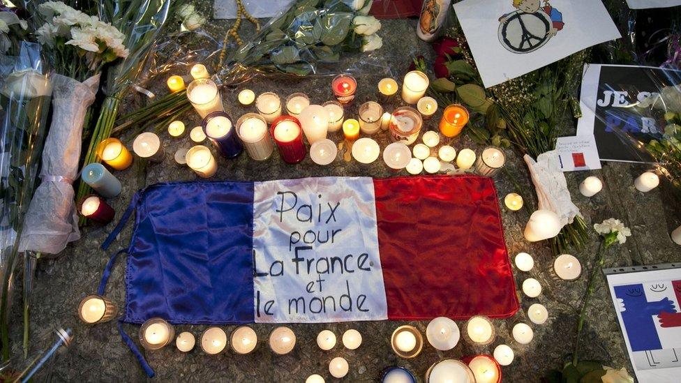 Candles and flowers outside French embassy in Mexico City during vigil for victims of attacks in Paris. 16 Nov 2015