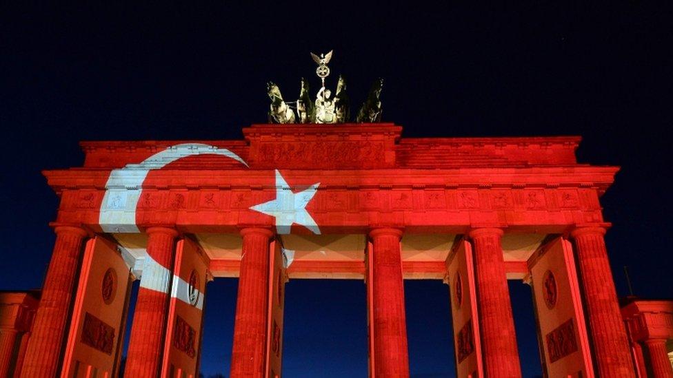 The Brandenburg Gate in Berlin is lit up in remembrance