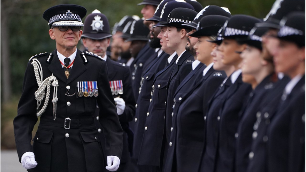 Metropolitan Police Commissioner Mark Rowley inspects new police recruits during his first passing-out parade