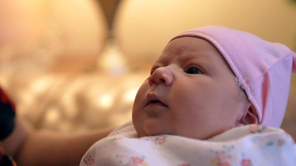 A close-up of a baby girl