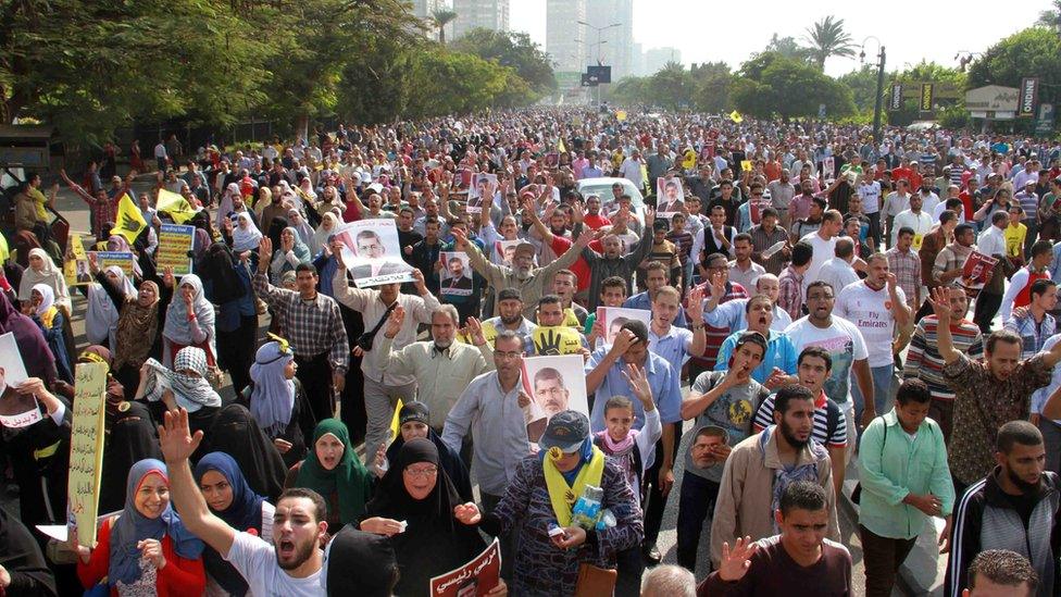 Egyptian Muslim brotherhood and supporters of ousted Islamist president Mohamed Morsi rally outside Egypt's Supreme Constitutional Court in Cairo on November 4, 2013