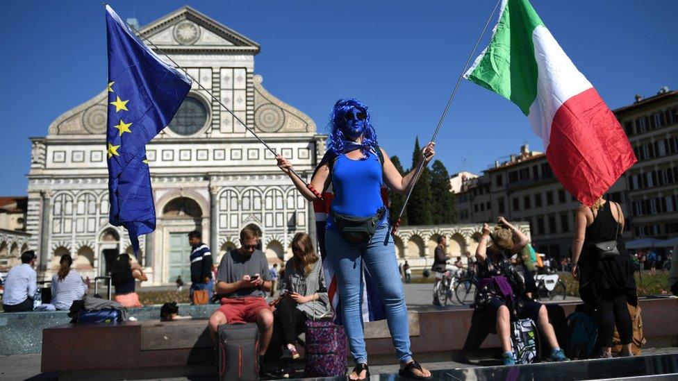 A pro-EU campaigner protests in Florence ahead of Theresa May's speech