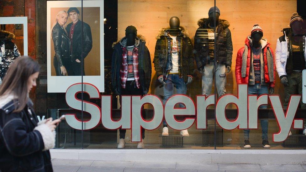 Shopper walks past Superdry