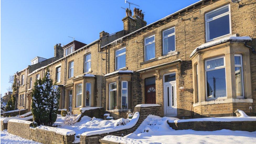 row of houses in the snow