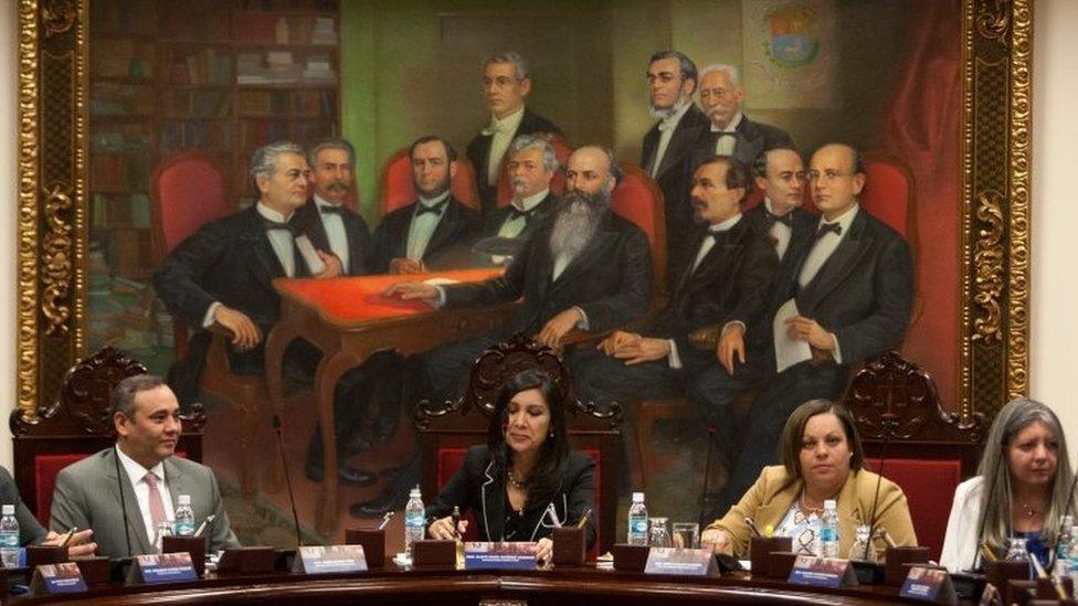 The president of the Venezuelan Supreme Court of Justice, Gladys Gutierrez (centre) heads a meeting with new judges at the National Assembly in Caracas on 23 December 2015.