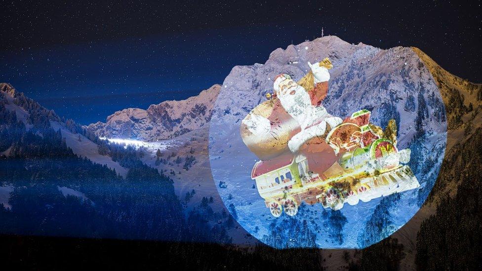 An image of Santa Claus is projected on the Rochers-de-Naye mountain on the sidelines of the Montreux Christmas market, in Haut de Caux near Montreux, Switzerland, 06 December 2023. The figure is projected from a distance of 2300 meters and covers a surface of over 28000 square meters, a world record according to the author of the project Swiss light artist Gerry Hofstetter.