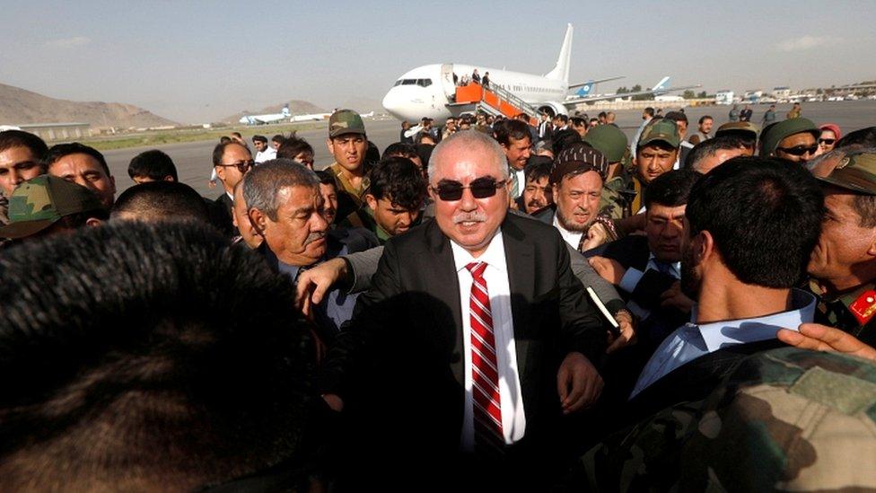 Gen Dostum was by supporters and high-ranking officials at Kabul airport