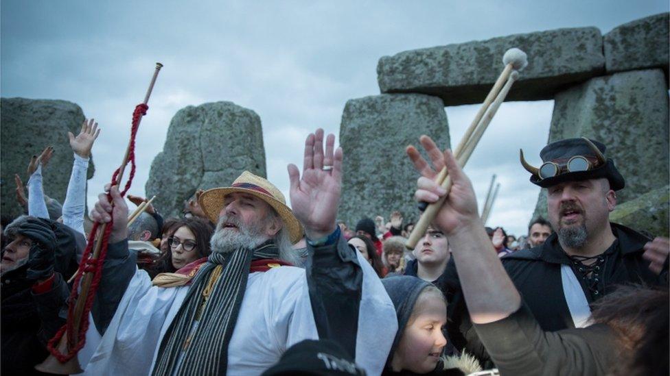 Rollo Maughfling and others gather inside the stone circle