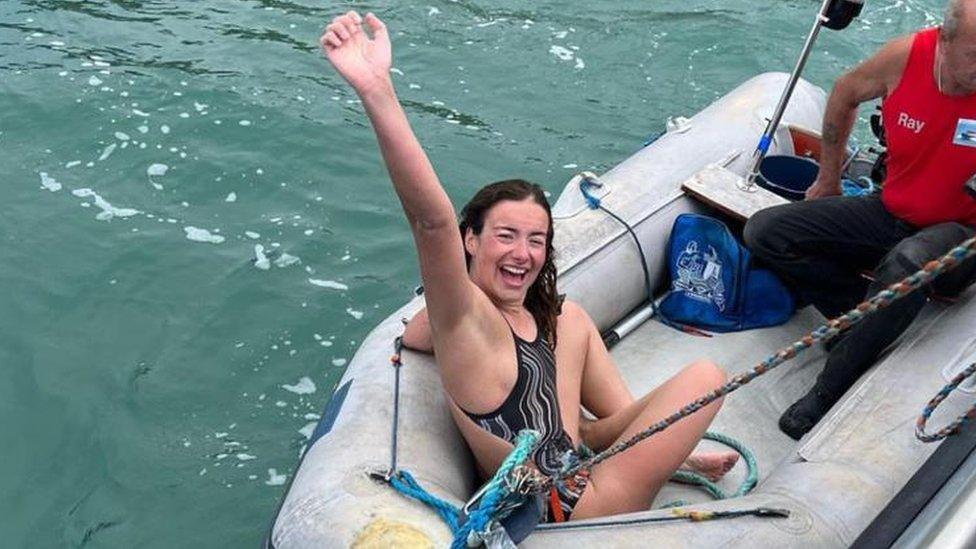 Evie Anema on a boat having swam the English Channel