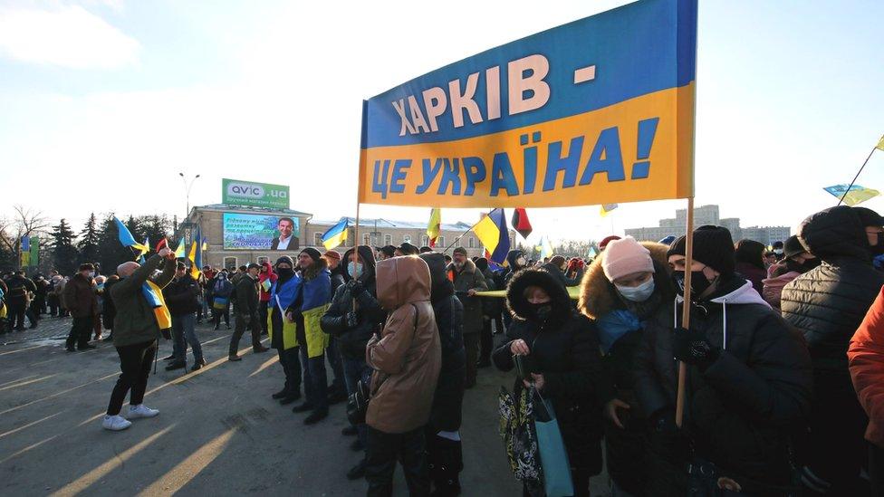 Activists hold the Kharkiv is Ukraine banner during the Unity March in Kharkiv, northeastern Ukraine, 5 Feb 2022