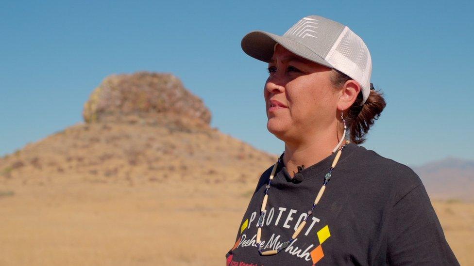 Ka'ila Farrell-Smith stands in front of Sentinel Rock