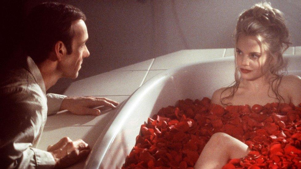 Lester Burnham (Kevin Spacey Is Intrigued By Angela (Mena Suvari) in "American Beauty"