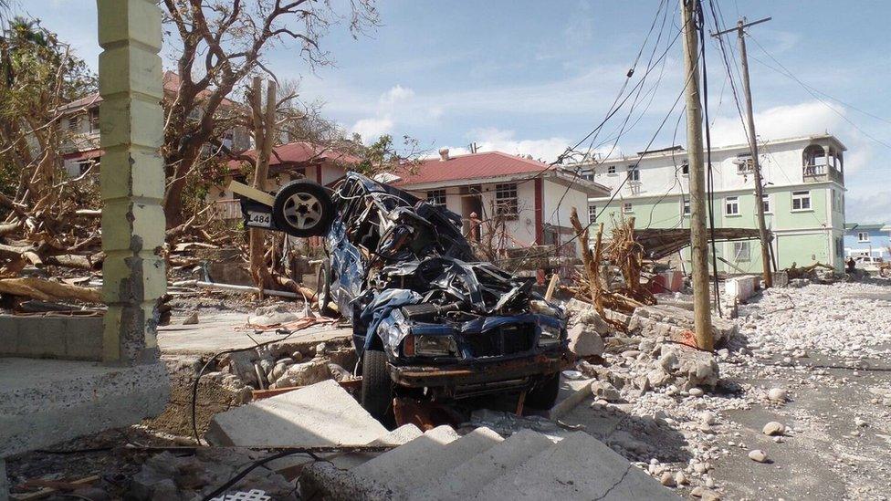 A car lies mangled in Scott's Head.