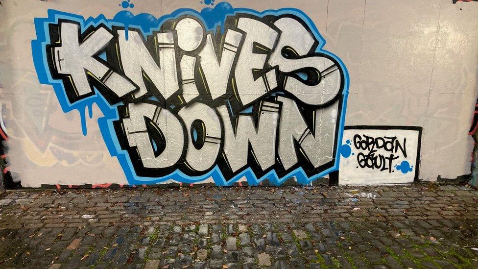 Graffiti artwork in Gateshead with the words Knives Down