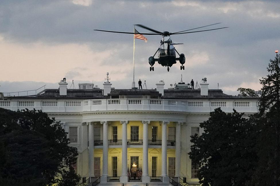 Marine One helicopter carrying the president lands on the White House lawn