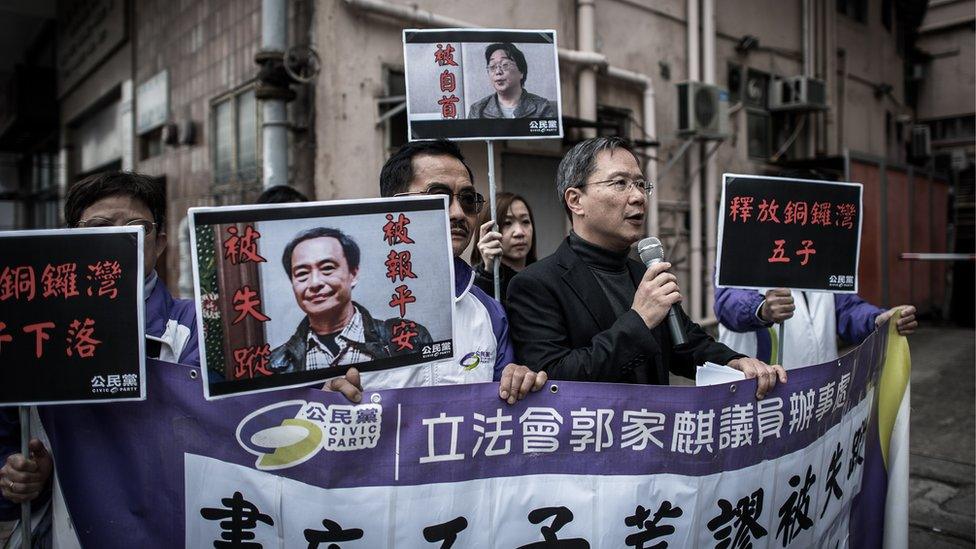 Members of the Civic party voice their concern about missing booksellers outside the China liaison office in Hong Kong on January 19, 2016.