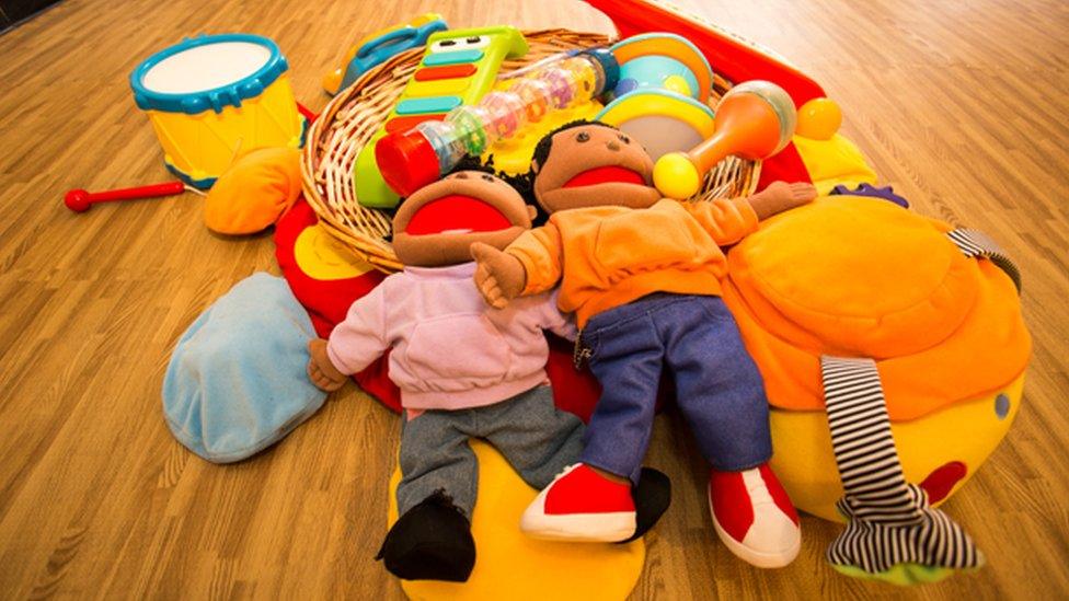 Soft toys on a wooden floor