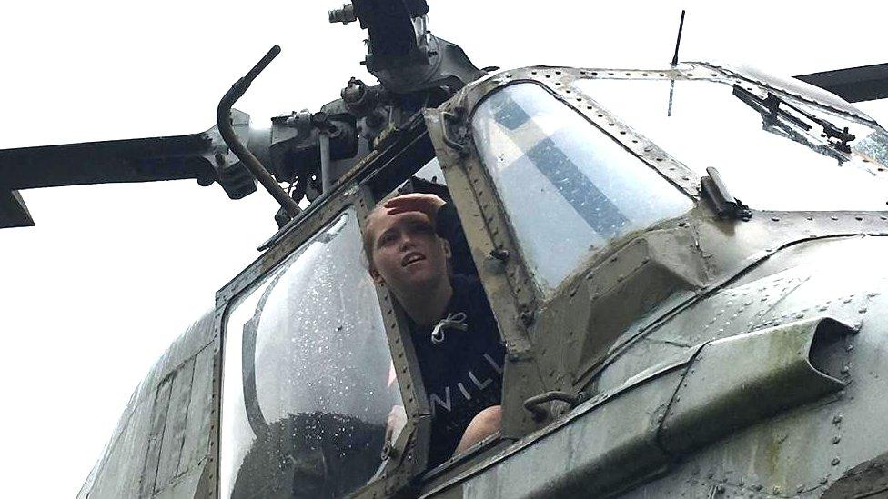 Mikyla Dillon, then aged 17, looking out of the window of the helicopter cockpit