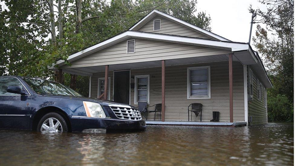 Flood waters surround a home after Hurricane Florence passed through the area