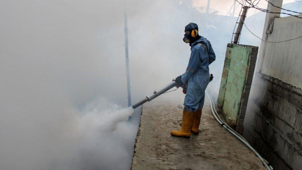 A man fumigating in Indonesia