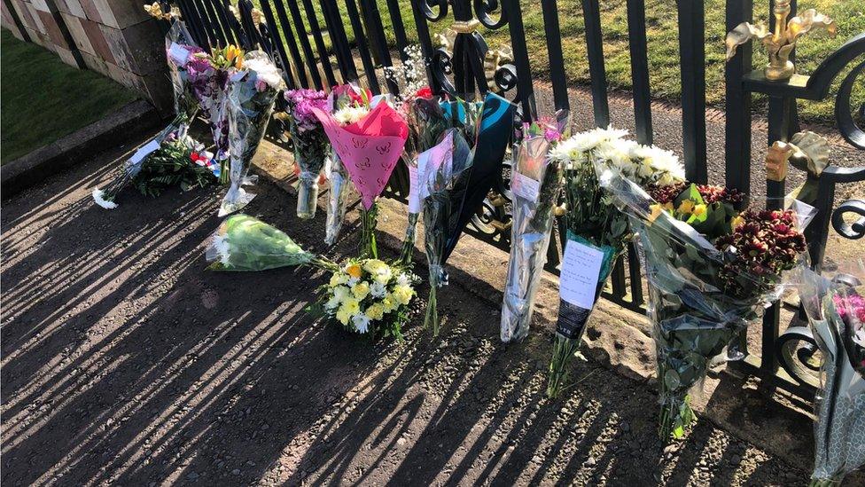 Flowers left at Hillsborough Castle on Friday evening