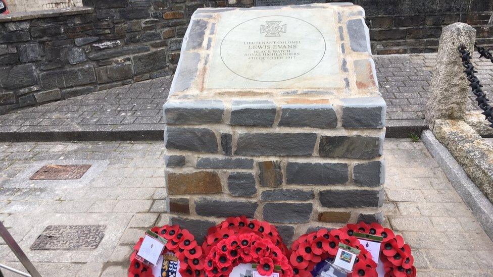 Poppy wreaths laid at the stone dedicated to Gen Evans