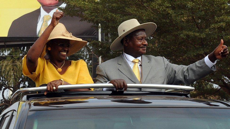 Uganda's incumbent president Yoweri Museveni (R) and his wife Janet Kataha Museveni give the thumbs up to supporters on February 16, 2011 during his last public rally at Kololo Airstrip in Kampala, two days before the general elections.