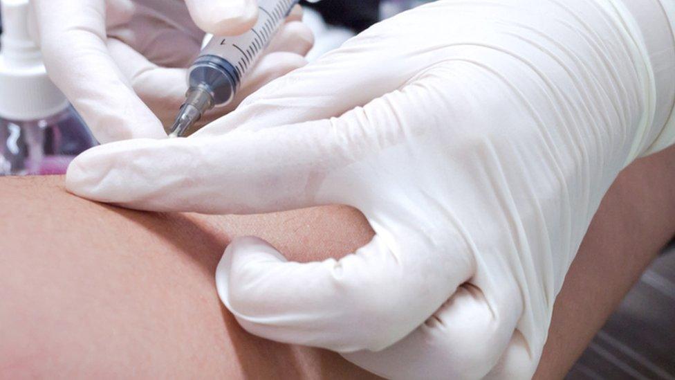 Medical staff doing a blood test