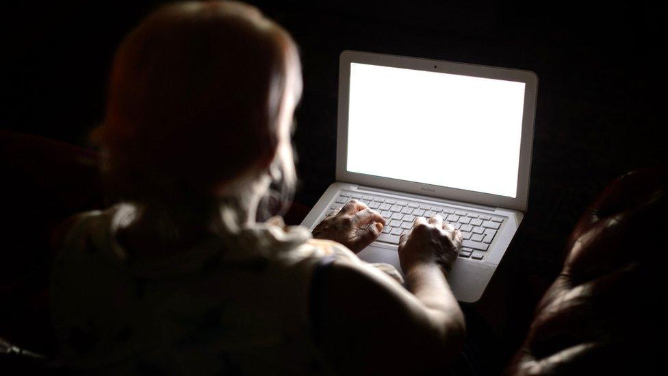 Woman typing on computer