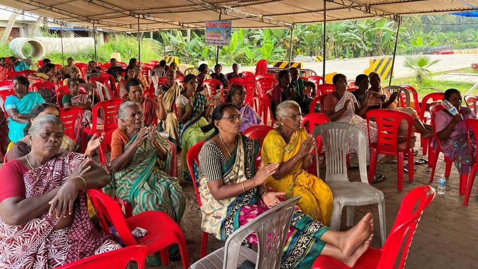 Women from the fishing community seen at a protest site in Vizhinjam