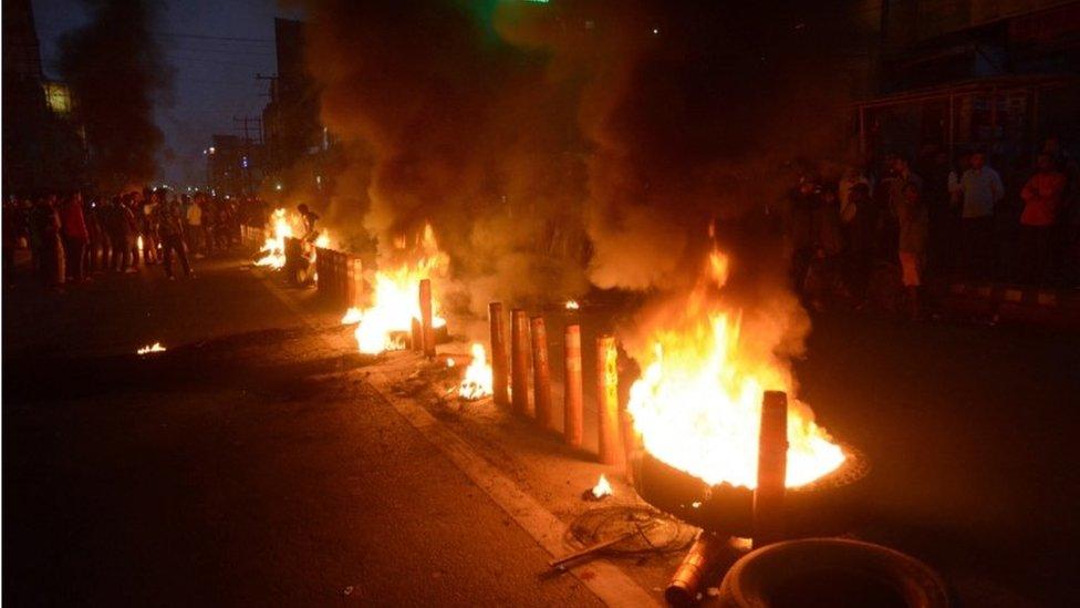 Protesters burn tries on road they protest against the Citizenship Amendment Bill 2019 in Guwahati Assam, India, 11 December 2019