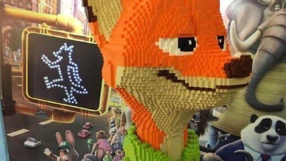 Photo of statue of Nick from the film Zootopia made out of LEGO.