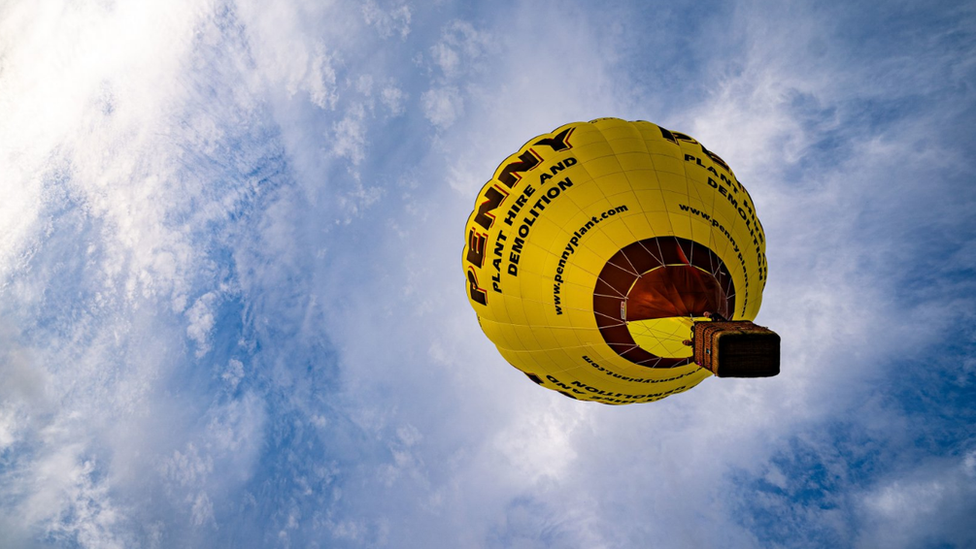 One yellow hot air balloon