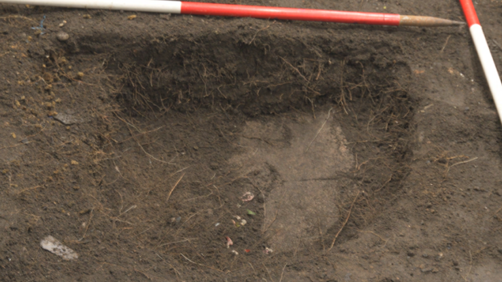 A shallow grave where the remains were found